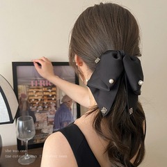 蝶結びのヘアピンの黒いレトロなリボンのヘアピンのサテンの高級感のクリップの後頭部の低い馬尾のヘアピンの飾り