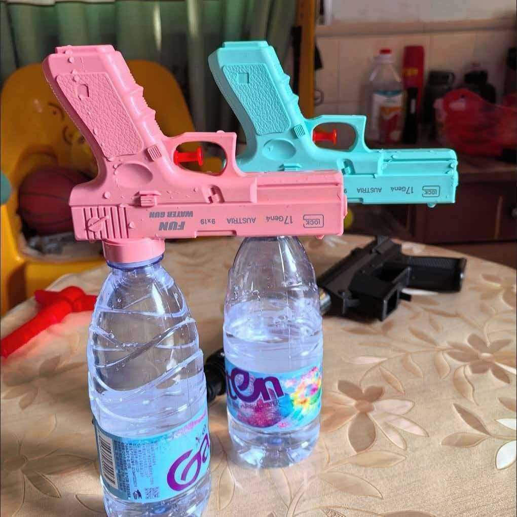 Large-capacity water gun that can hold mineral water bottles, perfect for outdoor water fights and summer fun.