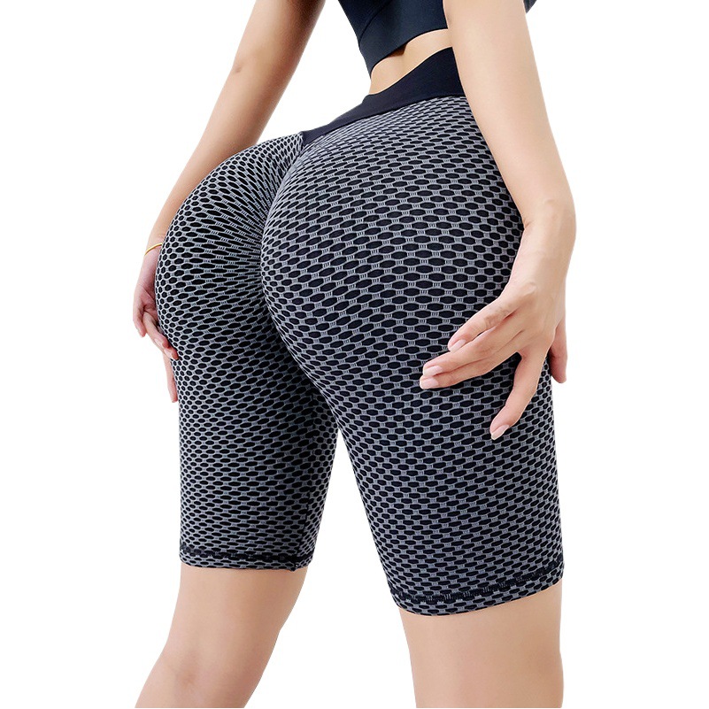 Panal europeo y americano sin costuras melocotón cadera pantalones de yoga de cinco puntos cintura alta estiramiento cadera medias deportivas Levantamiento de cadera pantalones de fitness