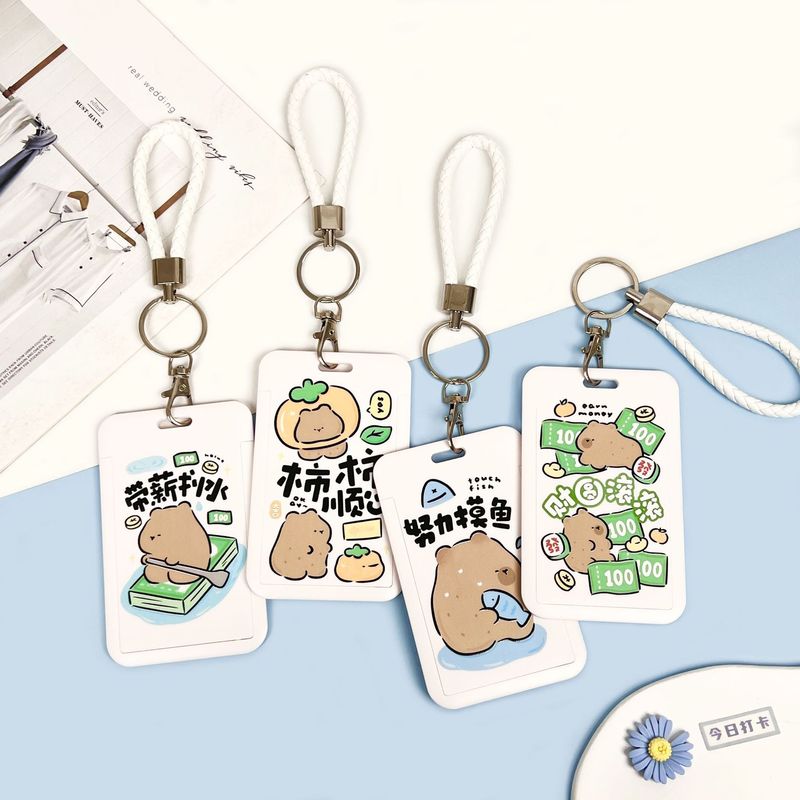 学生の漫画のカードカバーのかわいい熊の食事カードのバスの地下鉄のカードの包みはぼろぼろな文学の胸の札の保護カバーのメーカーを並べます。|undefined