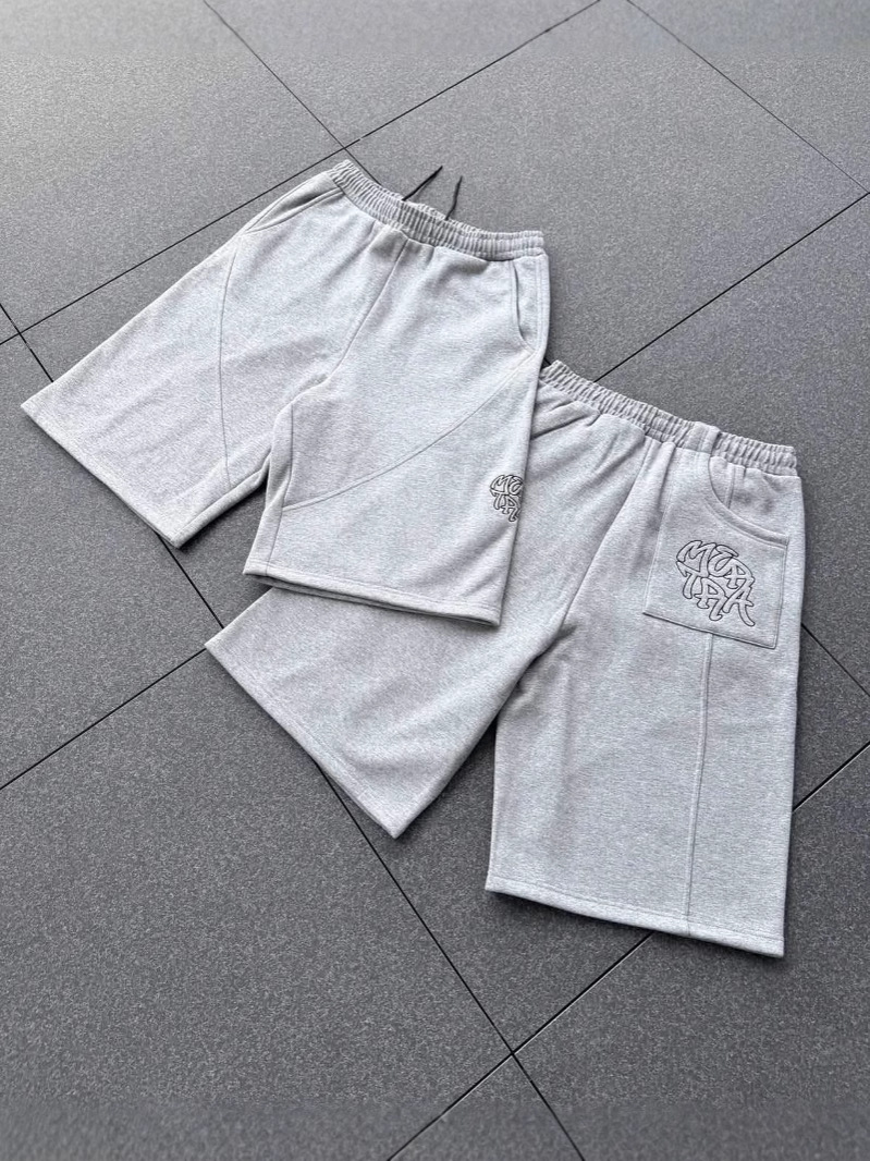 Europeos y estadounidenses bordados transfronterizos pantalones de cinco puntos, pantalones casuales para hombres y mujeres, pantalones cortos de moda relajados hip-hop retro americanos