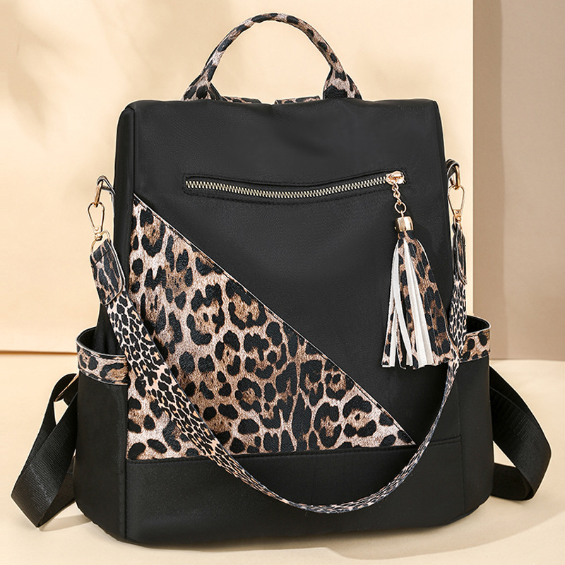 Comercio exterior al por mayor 2025 nuevo estilo antirrobo señoras mochila moda leopardo borla viaje al aire libre mochila de doble uso marea