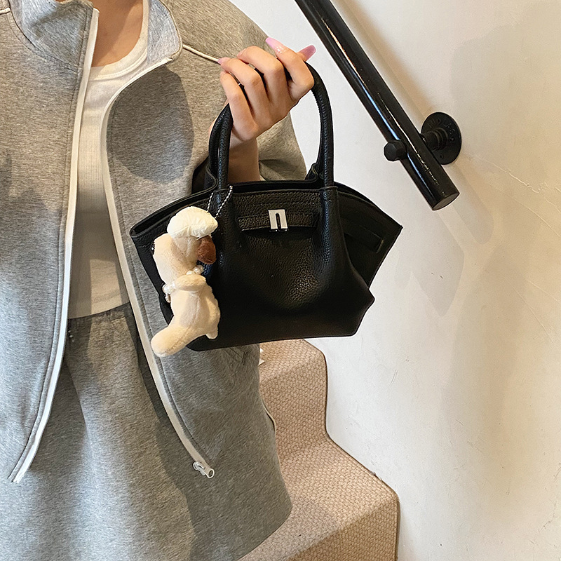 Bolso de cubo de estilo explosivo de moda para mujer, nuevo bolso de hombro de estilo occidental de todo fósforo 2025, bolso de mensajero súper caliente con pliegues de moda