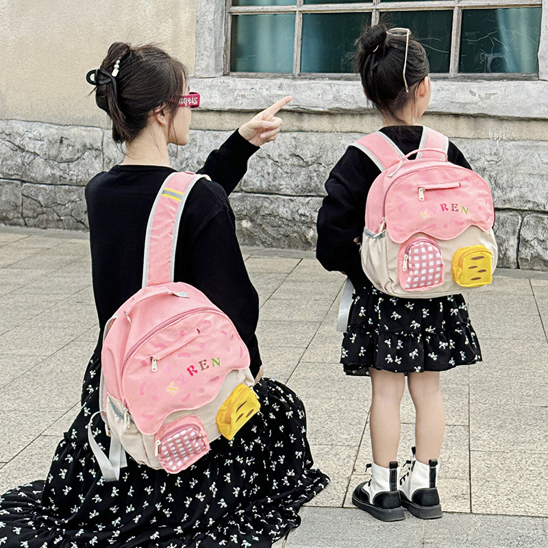 Nueva mochila infantil, jardín de infantes, mochila escolar ligera para niños y niñas, moda de color, mochila casual para padres e hijos.