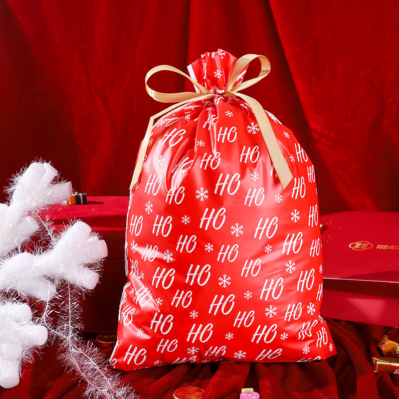 クロスボーダー専用の大サイズのプラスチック製のプレゼント袋、クリスマスイブの口にプレゼント袋を包装します。|undefined