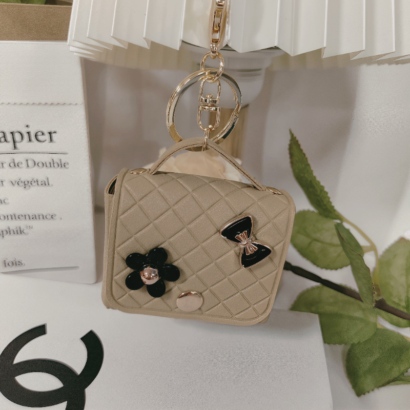 Nuevo estilo transfronterizo, moderno y exclusivo mini bolso acolchado tipo colgante, monedero para llaves, accesorio para auriculares.