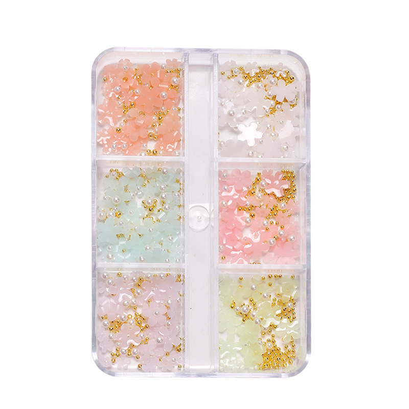 Manicura de estilo japonés joyería de flores de cinco pétalos joyería de flores pequeñas tridimensionales que cambian la luz Internet celebridad resina accesorios de uñas de flores de cinco pétalos