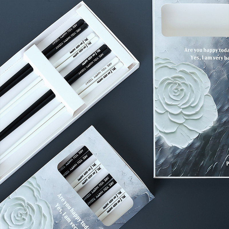 Palillos de estilo francés Hepburn ins moda color blanco y negro palillos de cerámica de alto valor conjunto de regalo para el hogar al por mayor