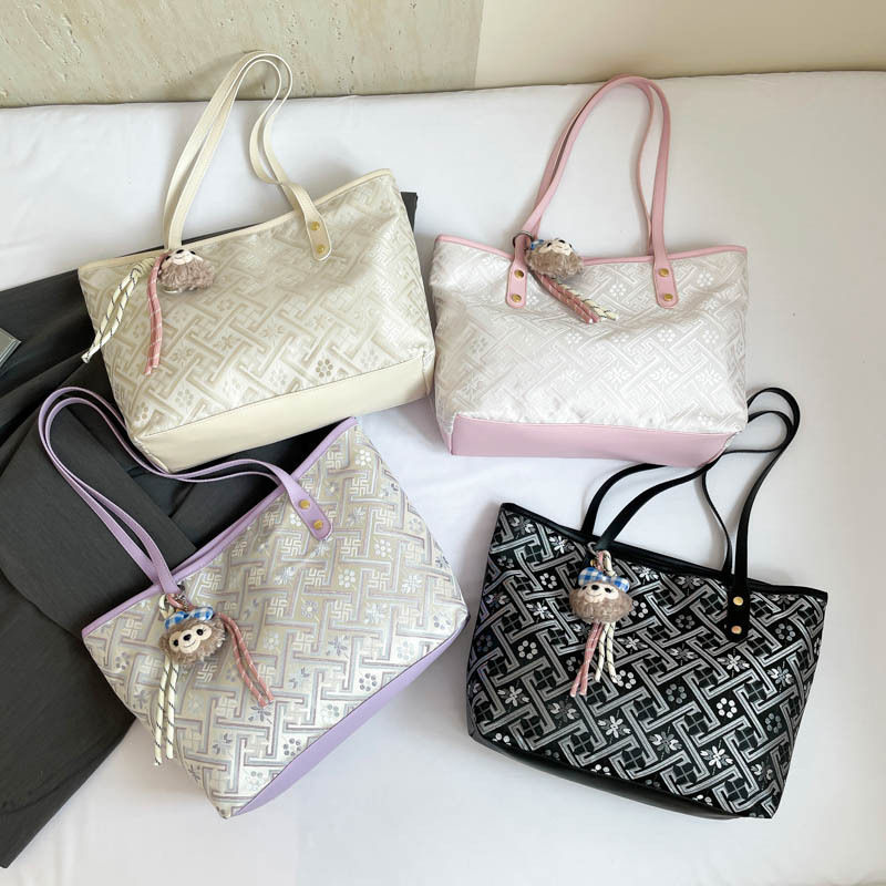 2025 nuevo estilo nacional de diseño de patrón oscuro bolso de mujer gran capacidad versátil bolso de viaje bolso de hombro de moda ligero de lujo
