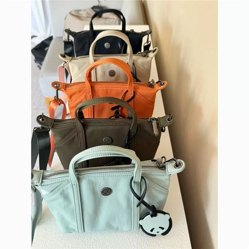 Новая мини-сумка нишевого цвета макарон, портативная сумка через плечо, простая, модная, легкая и модная.