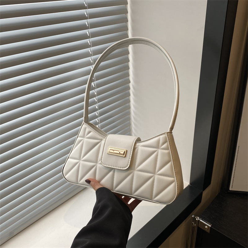 Bolso de nicho francés de textura occidental 2024 nuevo bolso femenino color sólido popular bandolera de hombro bolso de palo francés de axila