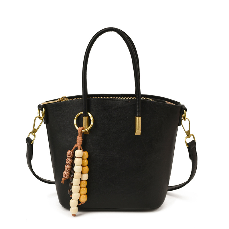 Bolsa de mano de textura retro de gran capacidad para mujeres otoño y invierno 2025 nuevo tipo de mochila de transporte público bolsa de hombro universal