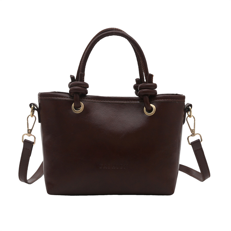 Bolso de moda simple 2025 primavera nuevo retro textura bolso de cubo de moda color sólido viaje mochila de hombro