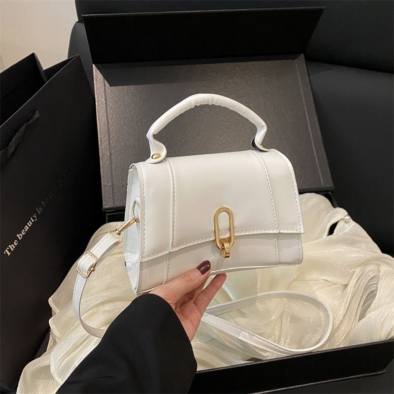 Bolso de mano coreano 2025 primavera nueva bolsa de moda de mujer con bloqueo de moda bolso de hombro simple de viaje