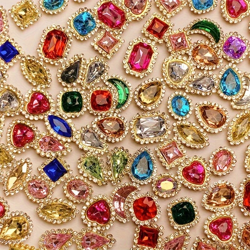 Mixed set of sunflower multi-color rhinestone clasps, flat-bottomed four-hole multi-color claw rhinestones, high-gloss acrylic rhinestones, and crystal pear-shaped rhinestones Mixed set of sunflower multi-color rhinestone clasps, flat-bottomed four-hole multi-color claw rhinestones, high-gloss acrylic rhinestones, and crystal pear-shaped rhinestones