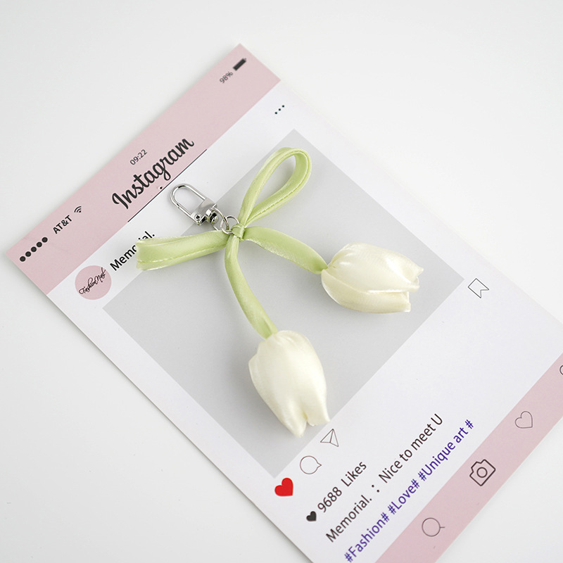 Venta caliente todo fósforo tulipán perla rosa serpentina arco púrpura colgante amor llavero bolso colgante