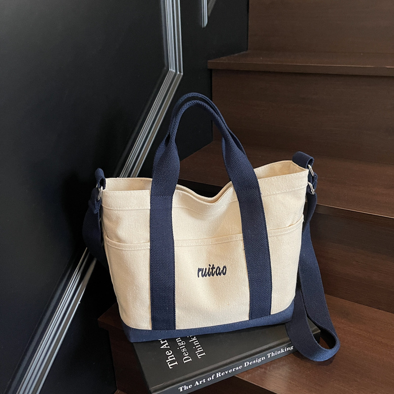 Bolso Tote de moda coreana 2025 verano nuevo estilo bolso de hombro estilo universitario bolso de mensajero de lona de color de contraste mujer