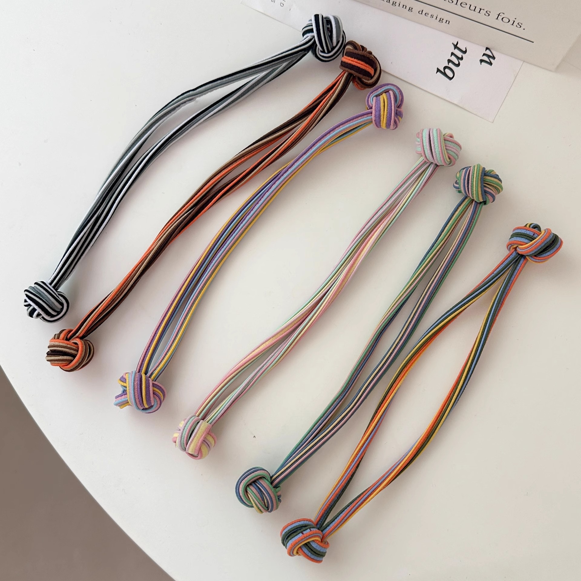 Anillo de cabello de nudo de cola de cabello de alta elasticidad no lesionar cabello de banda de goma roja durable cabello de cola de cabello de mujer al por mayor