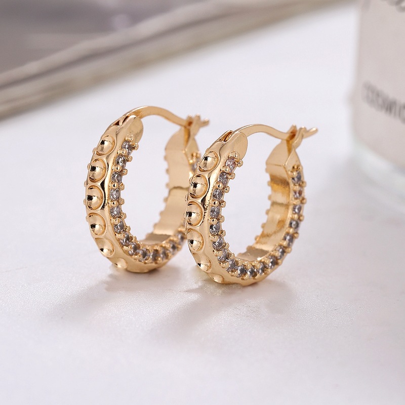 Pendientes exagerados transfronterizos europeos y americanos de alto sentido nicho geométrico pendientes redondos Luz de lujo pendientes de diamantes de personalidad femenina al por mayor