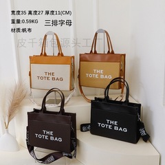 国境を越えた新型のトートバッグには、大容量の通勤女性バッグの高級感があります。