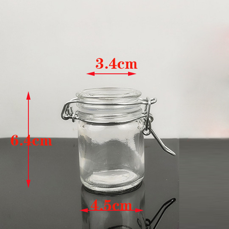 Hebilla tarro de almacenamiento botella de vidrio redondo tarro de caramelo tarro de té de vela botella sellada botella de condimento botella de almacenamiento pequeña