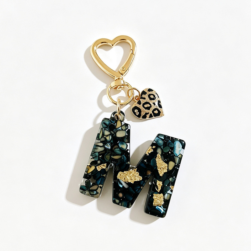 Manufacturer wholesale classic black initial resin keychains, featuring cute leopard print and heart-shaped bag charms Manufacturer wholesale classic black initial resin keychains, featuring cute leopard print and heart-shaped bag charms