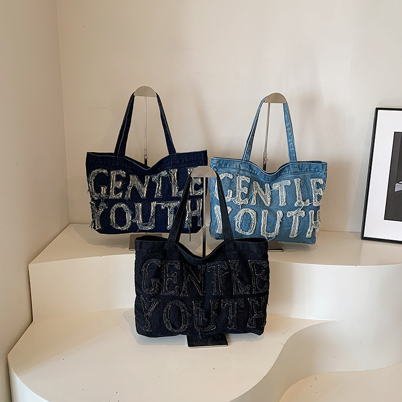 Bolsa de denim de gran capacidad para mujeres 2024 temperamento retro ocio clase de viaje de hombro inclinado bolso inferior