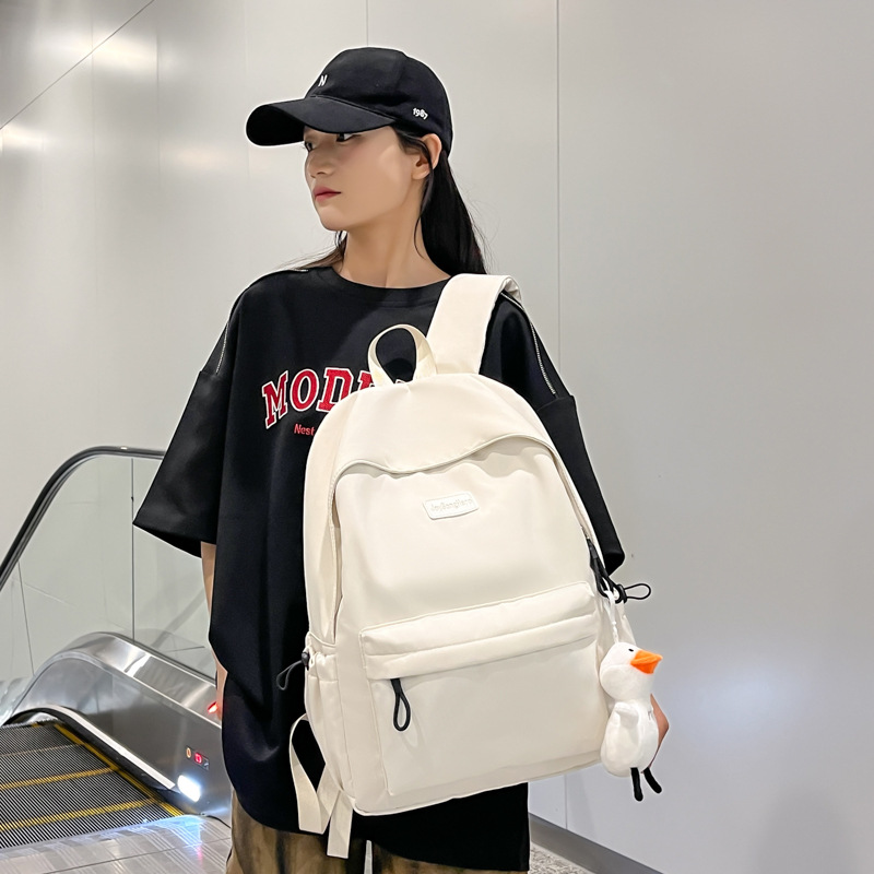 情侣款双肩包男女通用简约大容量学生书包轻便防水通勤电脑背包包