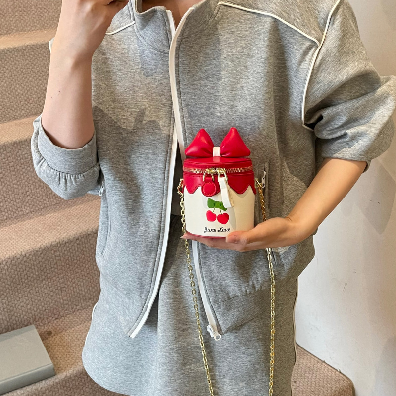 Bolso de cubo lindo japonés 2025 primavera y verano nuevo bolso femenino lindo lazo bolso de hombro mini cadena bolso de mensajero