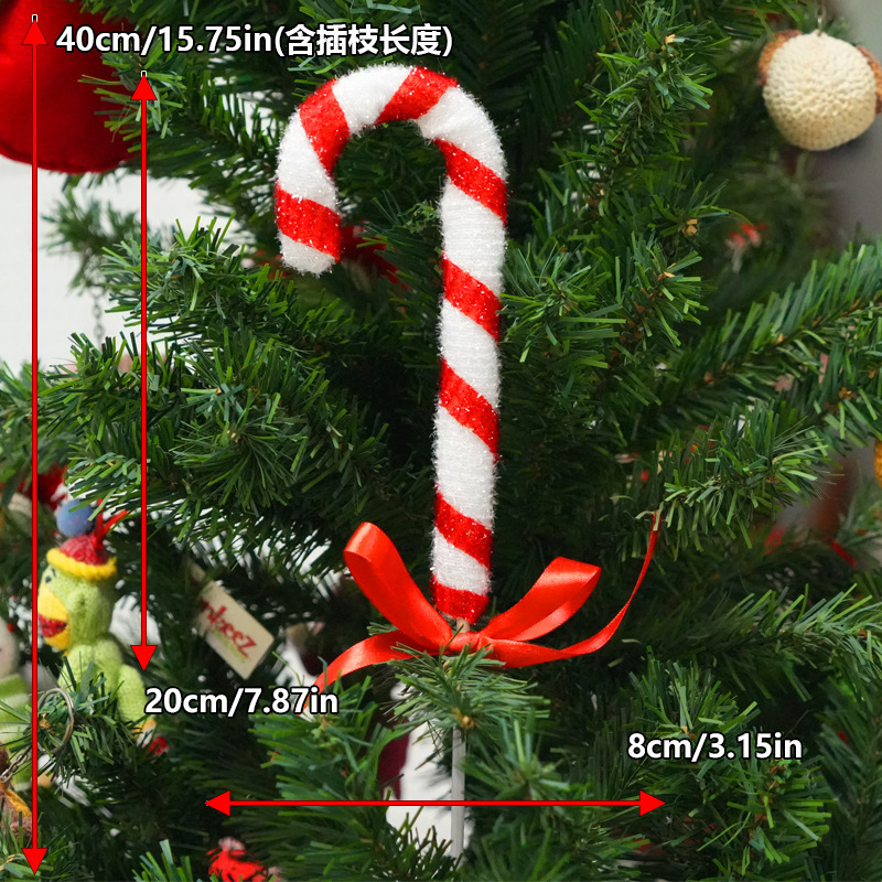 Pequeños insertos de caramelo rojo y blanco J