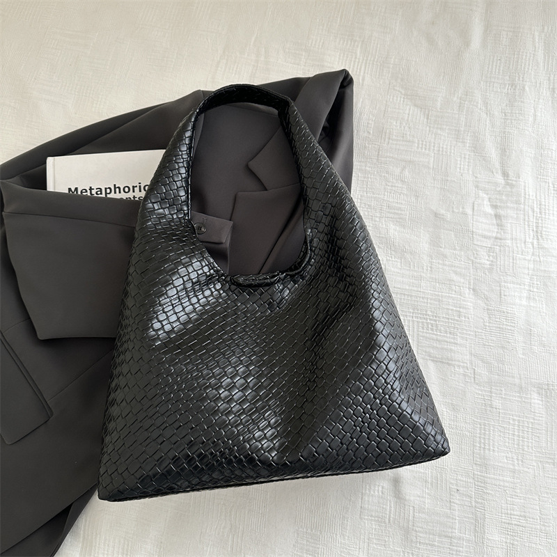 Casual diseño de gran capacidad de estilo extranjero bolso de hombro 2025 moda trenzado bolso de viaje simple retro bolso de brazo