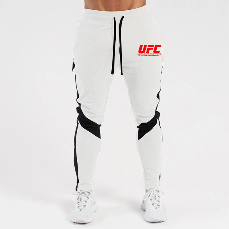 Otoño e invierno letras deportivas juventud ordinaria media elástica Mediados de cintura pantalones de algodón negro en stock moda de lana pantalones de los hombres