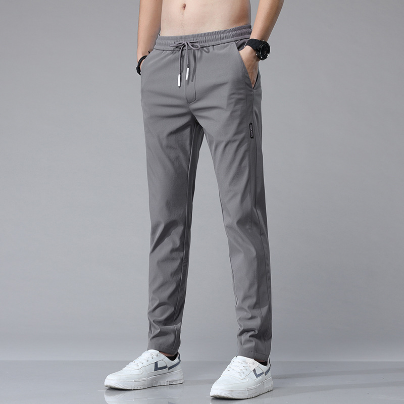 Pantalones casuales de hielo delgados de verano transfronterizos elásticos delgados de hombre 2026 nuevos pantalones deportivos de secado rápido