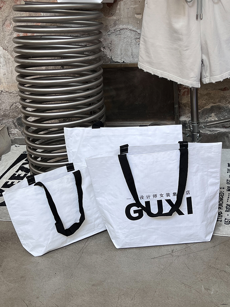 Tienda de ropa bolsa de tejido impresa LOGO ropa de mujer bolsa de compras regalos ropa al por mayor bolsa personalizada