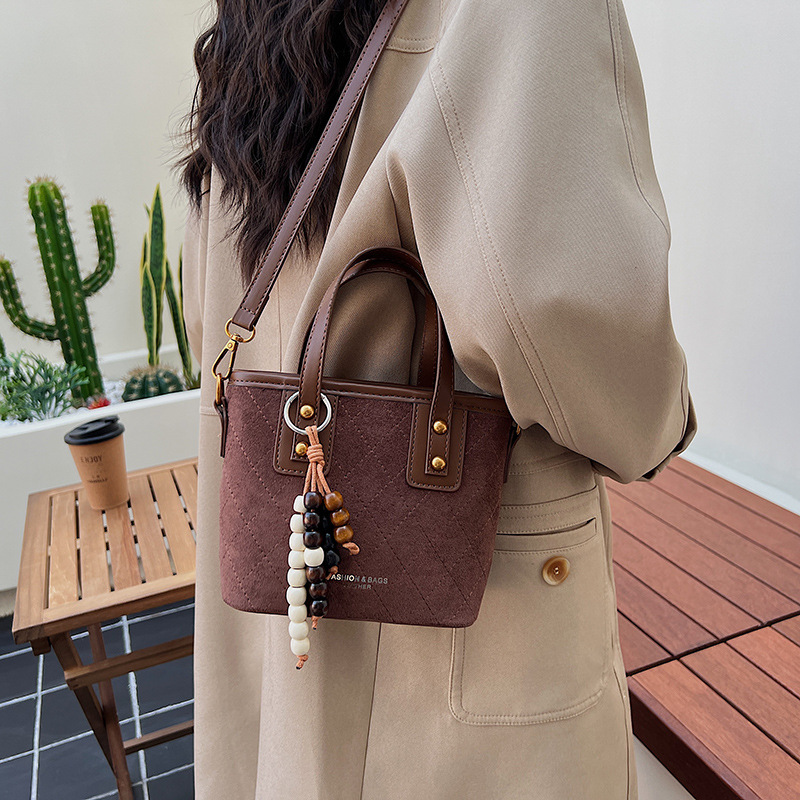 Transfronterizo retro gamuz bolsas de cubo de mano para mujeres 2025 nuevo estilo universal