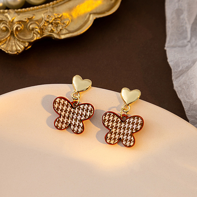 Otoño e Invierno Retro Maillard atmósfera de estampado de leopardo pendientes encantadores de alta calidad de pata de gallo de mariposa pendientes asimétricos