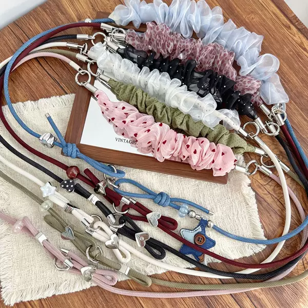 Trendy new styles of phone straps, braided cords, and colorful phone chains, available in various designs and colors, wholesale from the factory
