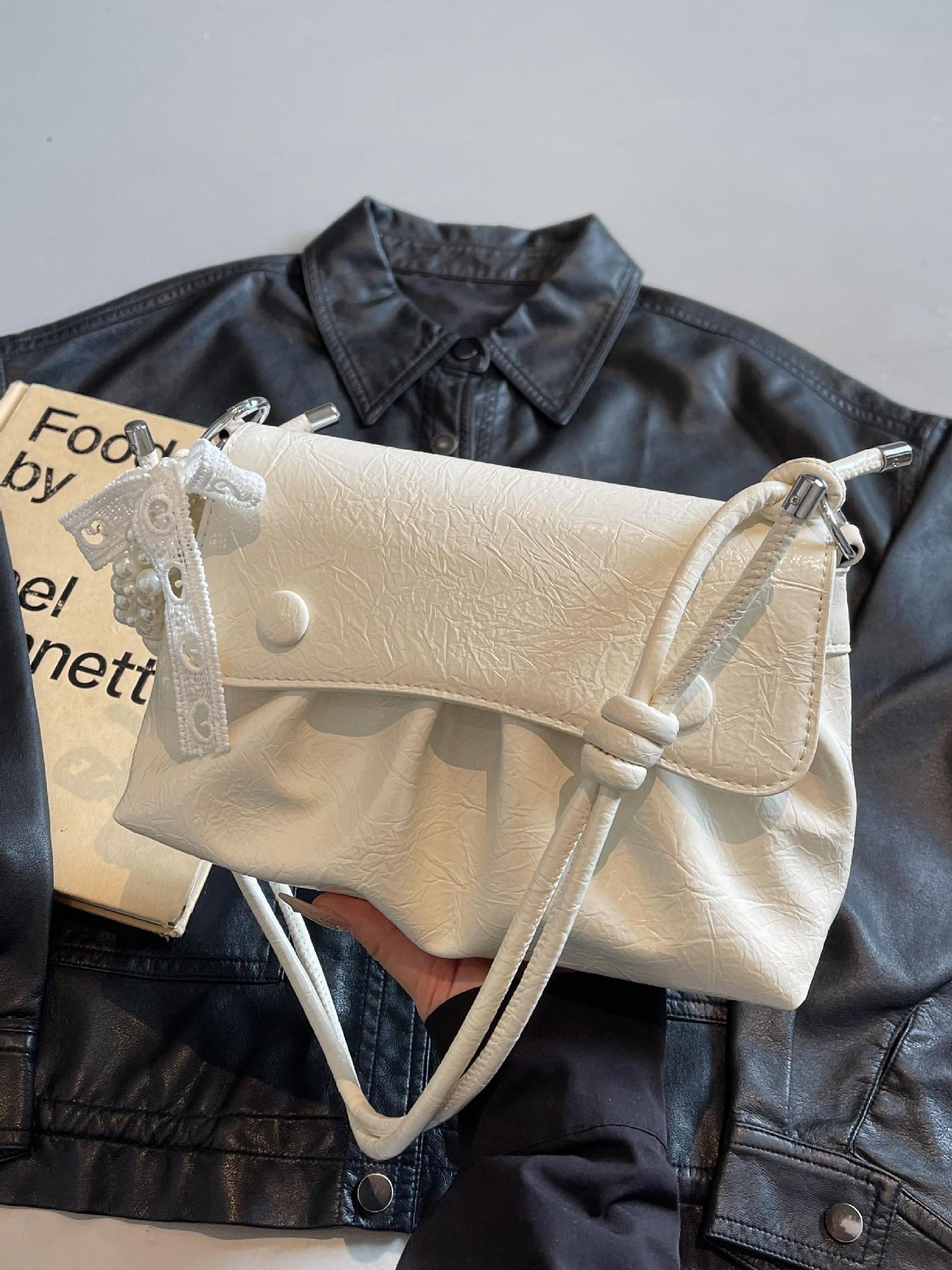 Bolso cuadrado pequeño estilo pop plisado popular de verano para mujer 2025 nuevo bolso de hombro de estilo occidental de todo fósforo bolso de axila de moda de nicho