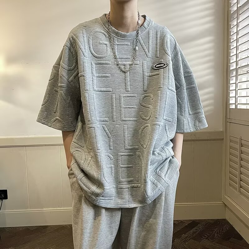 2026 camiseta de manga corta de verano hombre marca de moda de manga media suelta de cinco puntos estudiantes waffle Jacquard ropa de media manga