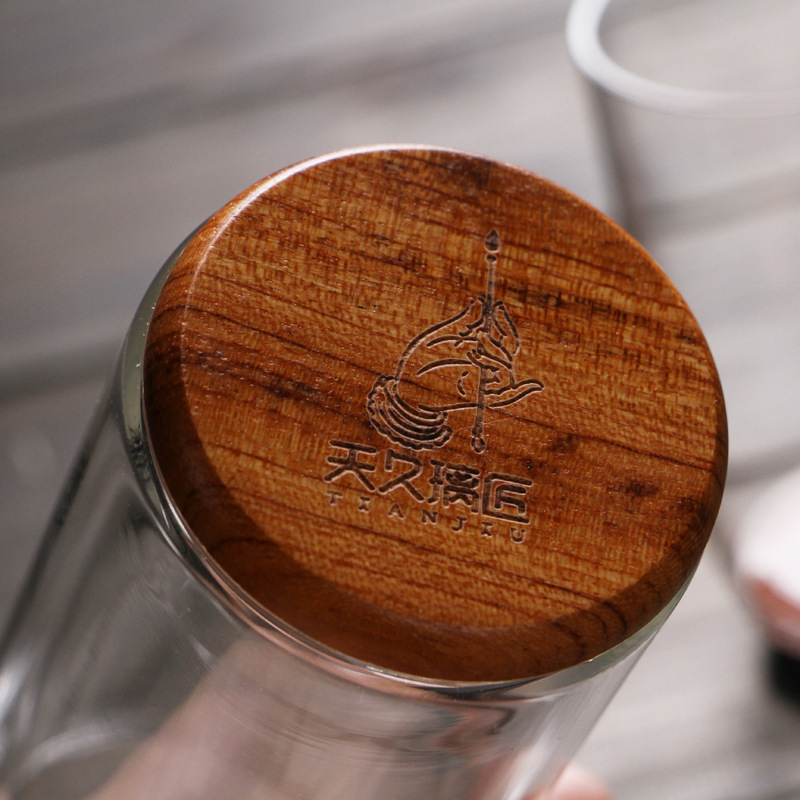 Vidrio transparente grueso resistente al calor inferior de madera aislamiento térmico de doble capa taza de té verde taza de agua creativa flor taza de té Tianjiu glass