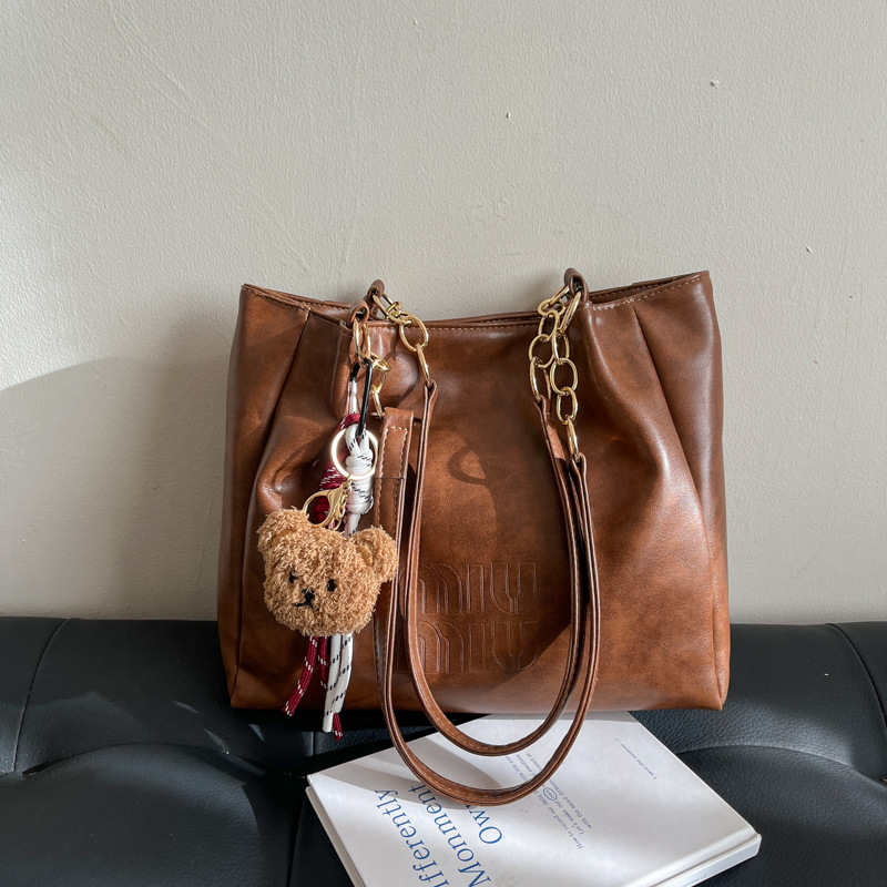 Bolsa de moda retro para estudiantes universitarios, bolsas de brazo para viajar en la primavera 2025, bolsas de ocio de nicho para mujeres.
