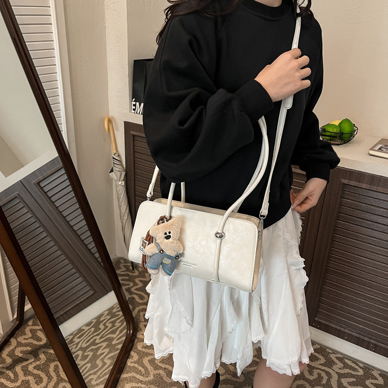 Simple retro bolso pequeño para mujeres 2026 nuevo bolso de estilo extranjero super caliente nicho diseño diario viaje bolsa de hombro