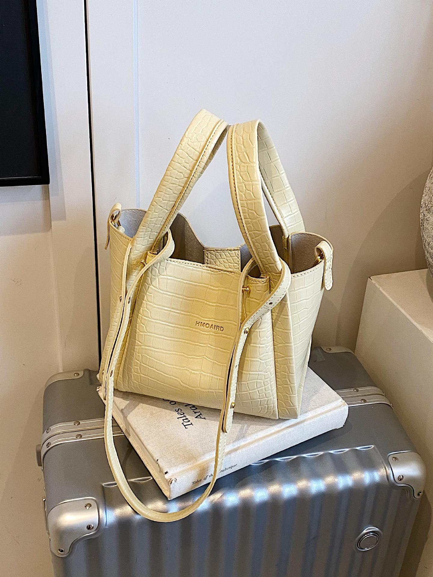 Bolso de cubo de mano de estilo explosivo con patrón de cocodrilo transfronterizo para mujer 2025 nuevo bolso de hombro con textura versátil bolso de mensajero súper caliente