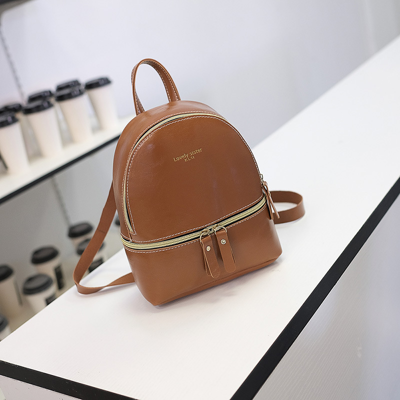 Bolso de mujer 2019 nuevo estilo aceite de cuero presión palabra mochila personalidad de la moda solo hombro pequeña mochila ventas directas de fábrica Moda