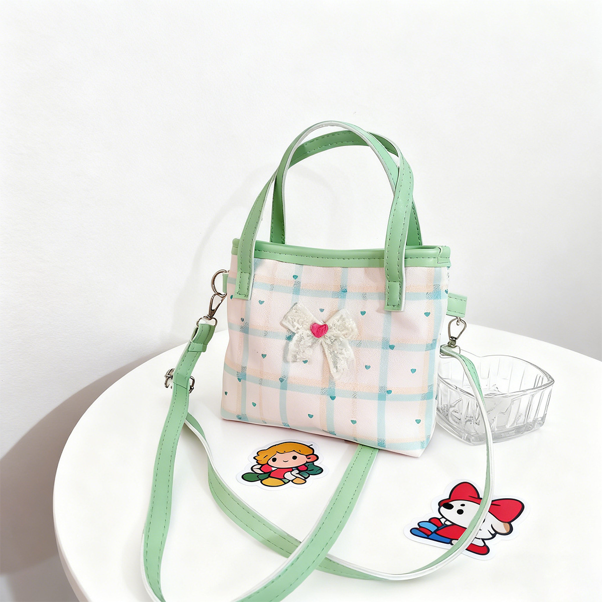 2026 nuevo bolso de niños lindos arcos de encaje bolsos de hombro para hombres y mujeres dulce bolso de mano para bebés