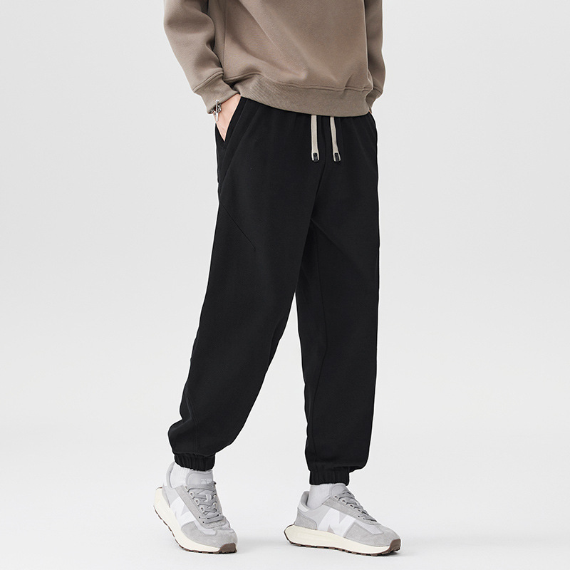 Pantalones casuales pesados negros para hombres sueltos 2025, nuevo otoño y invierno, pantalones deportivos gruesos con marca de algodón colgante