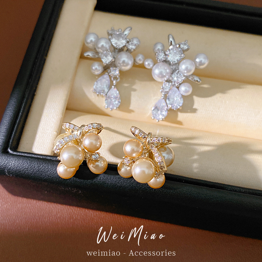 Agujas de plata mariposa gota de piedra aretes de perlas ligeros de lujo de alta calidad pernos diarios temperamento al por mayor auriculares