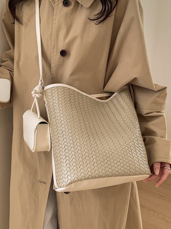 Diseño coreano de nicho de tejido bolso de cubo de agua de mujer nueva textura de alta calidad de hombro versátil bolso de tramo inclinado