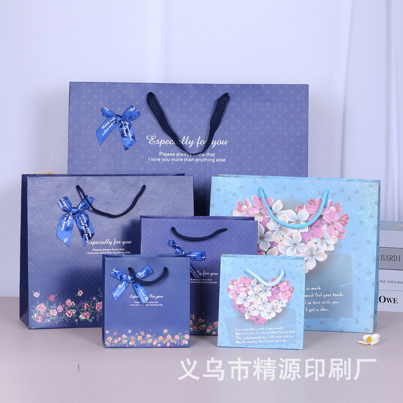 Spot wholesale fashion business floral gift bag wave point gift bag paper bag bouquet portable paper bag printed set