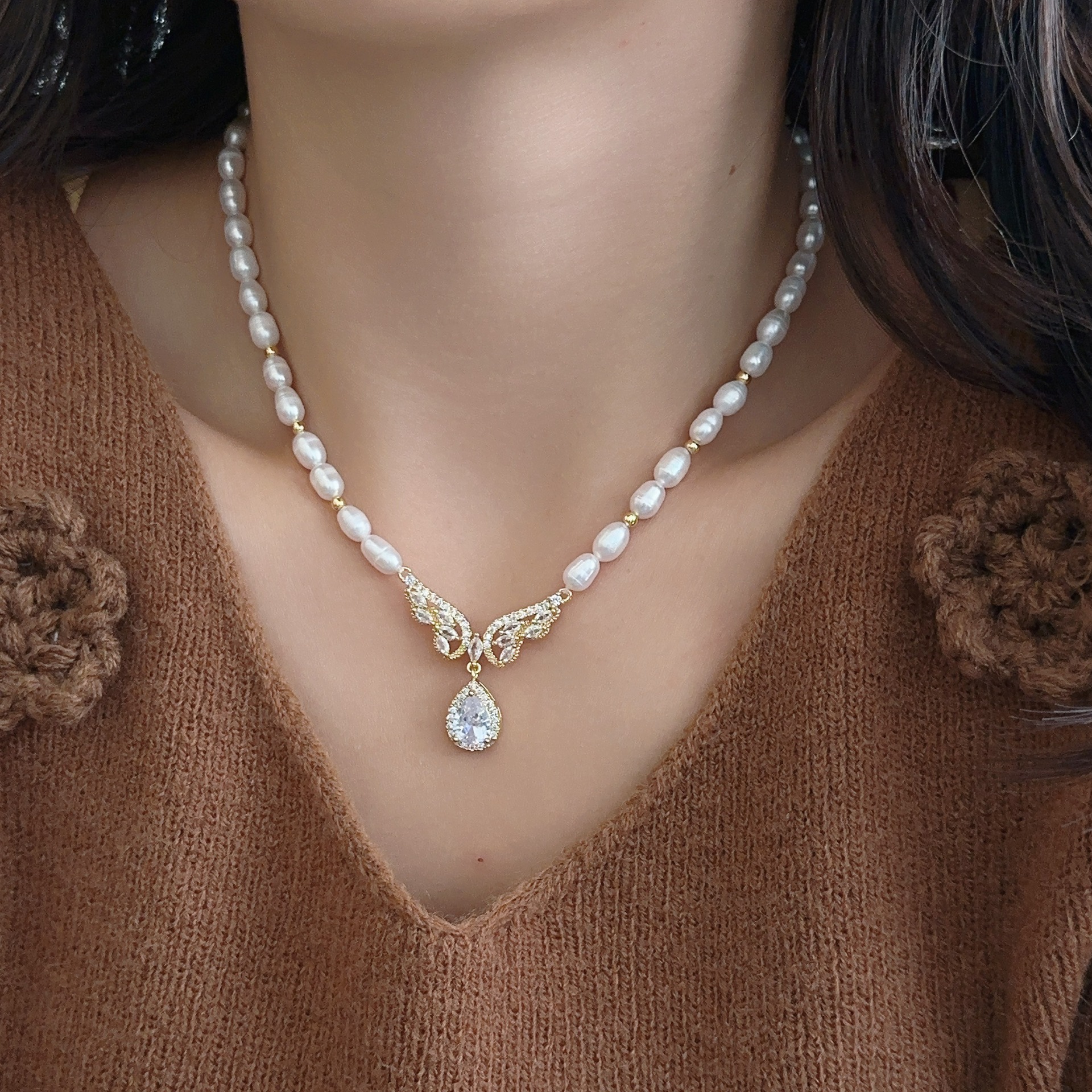 Zhuji Natural Freshwater Pearl Necklace Women's Elegant Fashion High-end Wings Pendant Niche Design Woolen Chain